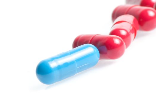 closeup of medical pills in laboratory on white table