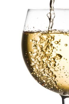 white wine pouring into half glass with space for text  on a white background