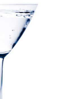 half white cocktail with blue reflections and space for text on white background