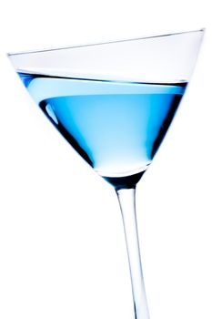 detail of blue cocktail tilted on a white background