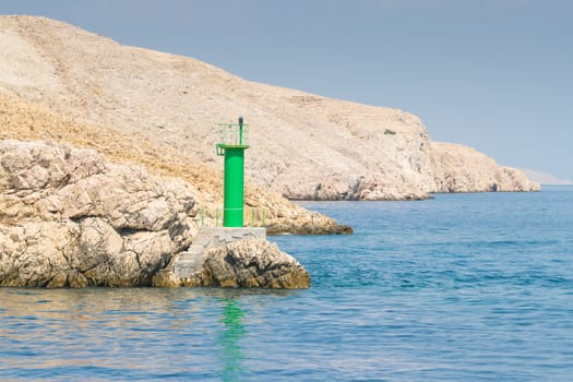 Lighthouse that signals the presence of rocks at passing ships.