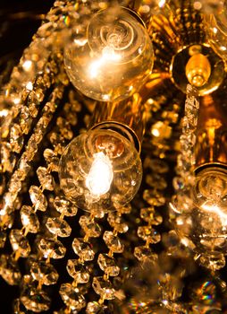 detail of a crystal chandelier with golden light