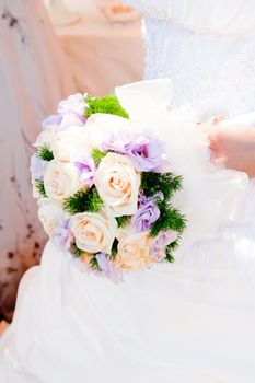 detail of wedding bouquet at bride's hands