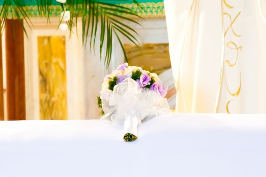 close-up of a wedding bouquet in the church on the table