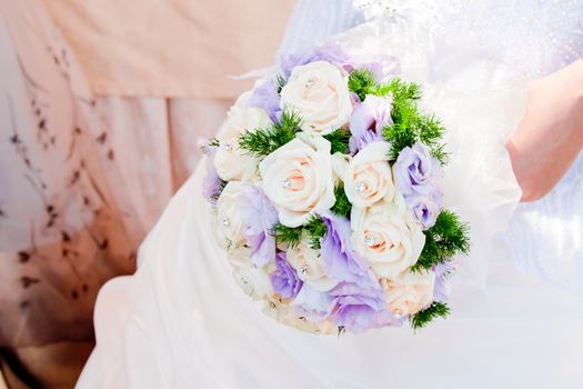 detail of wedding bouquet at bride's hands