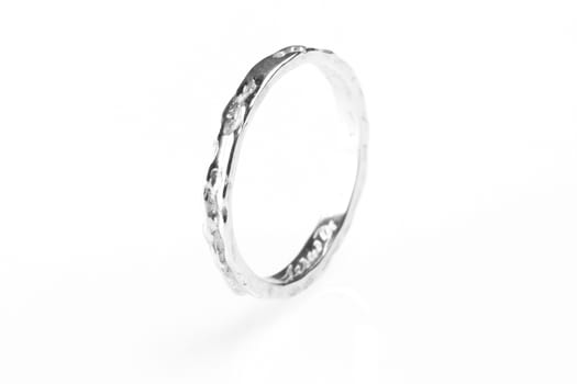 one white gold rings on white background