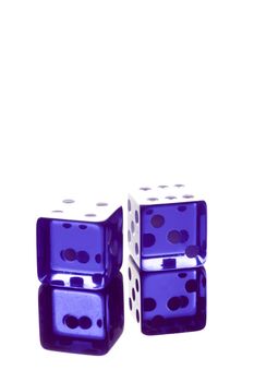 blue dice shot with high-key lighting on transparent table