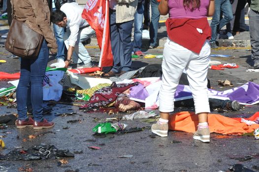 TURKEY, Ankara: Dead bodies lie on the ground after two explosions in the Turkish capital of Ankara killed nearly 100 people on October 10, 2015.The bombs went off near the main train station in the city. According to officials the bombs went off at a peace rally killing 97 and injuring 400 more.The rally was being held to call for an end to the conflict between the Turkish Government and the Kurdish PKK. As many as 14,000 people were at the rally when two suicide bombers detonated themselves in the crowd. No group has claimed responsibility yet for the attack. The death toll is expected to climb.