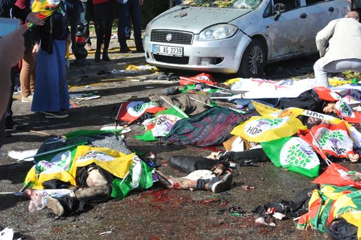 TURKEY, Ankara: Dead bodies lie on the ground after two explosions in the Turkish capital of Ankara killed nearly 100 people on October 10, 2015.The bombs went off near the main train station in the city. According to officials the bombs went off at a peace rally killing 97 and injuring 400 more.The rally was being held to call for an end to the conflict between the Turkish Government and the Kurdish PKK. As many as 14,000 people were at the rally when two suicide bombers detonated themselves in the crowd. No group has claimed responsibility yet for the attack. The death toll is expected to climb.