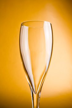 close up champagne glass on a golden background