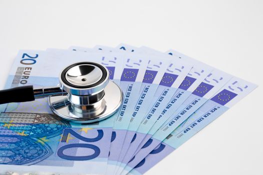 detail of stethoscope on  20-euro banknotes on white background