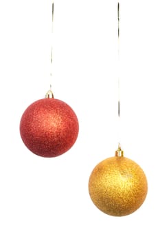 gold and red Christmas balls hanging on white background