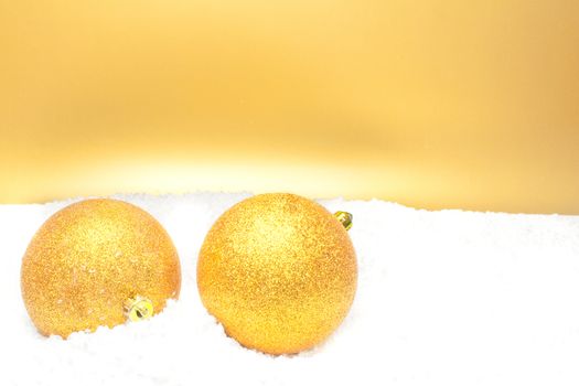 close up of a christmas balls on gold background