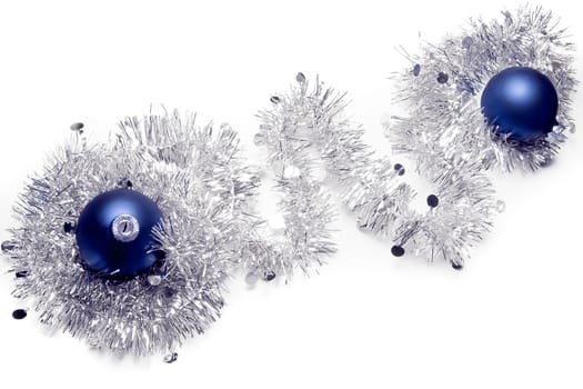 top view of the christmas decorations with blue balls on white background 