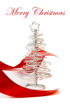 close up of a christmas silver tree with red decoration on white background