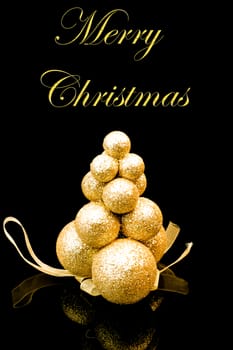 christmas golden tree on black background with space for text