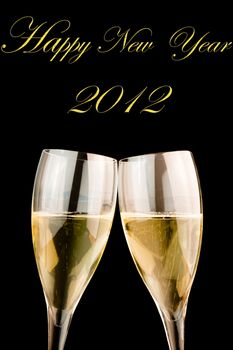 detail of glasses of champagne on black background with space for text