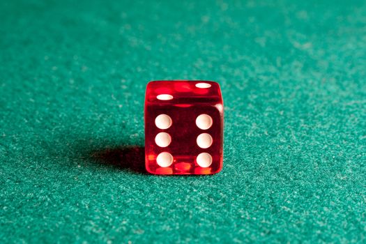 Close Up of  red dice on green table