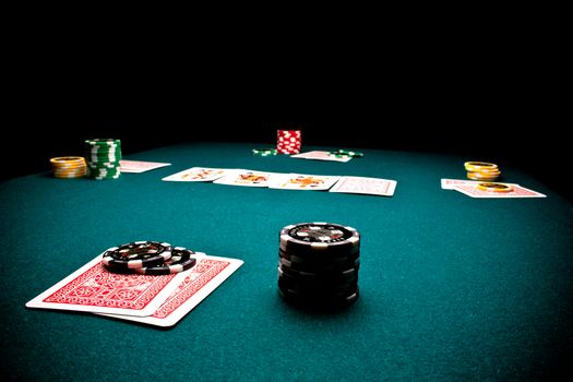 Close-up of poker players gaming table