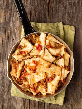 close up of rustic italian pasta in ragu sauce