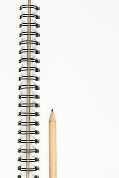 empty pages of opened notebook or sketchbook with pencil on wooden table, business, education, art