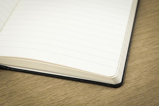 empty pages of opened notebook on wooden table, business, education