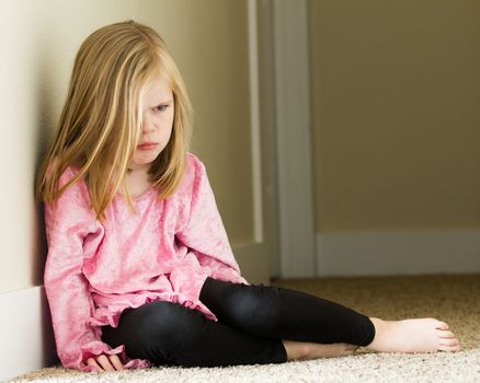 Girl sitting down upset and having a bad day