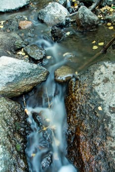 Small waterfall in a little river stream