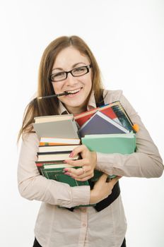 Europeans Portrait of a teacher with a bunch of textbooks and exercise books in the hands of