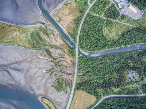 Aerial view of road passing through river delta in Norway