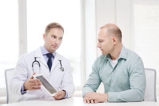 healthcare, technology and medicine concept - serious doctor with tablet pc computer and patient in hospital