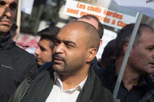 FRANCE, Paris : SOS Racism head Dominique Sopo stands while protesters gather in Place de la R�publique in Paris on October 11, 2015, for the second time after the terror attack in Ankara, in tribute to the victims of the twin explosion in Turkish capital city. On October 11, 2015, at least 95 people died after a twin explosion in the center of the capital city in Turkey. The Turkish government declared three days of mourning and said that it won't delay legislative elections expected for November 1st, 2015.