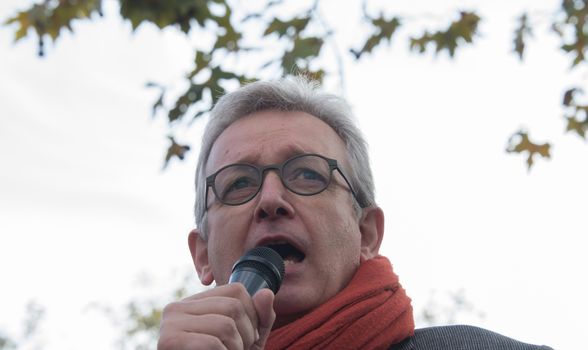 FRANCE, Paris : National head of Communist party Pierre Laurent makes a speech while protesters gather in Place de la R�publique in Paris on October 11, 2015, for the second time after the terror attack in Ankara, in tribute to the victims of the twin explosion in Turkish capital city. On October 11, 2015, at least 95 people died after a twin explosion in the center of the capital city in Turkey. The Turkish government declared three days of mourning and said that it won't delay legislative elections expected for November 1st, 2015. 