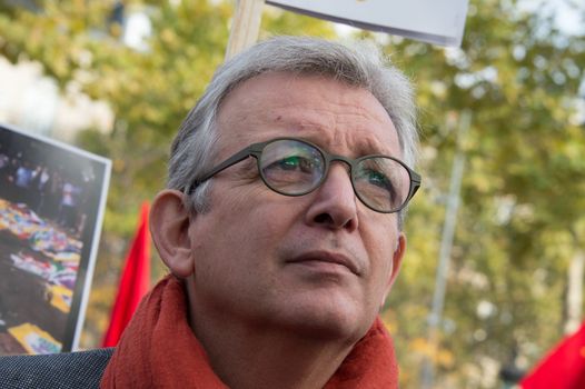 FRANCE, Paris : National head of Communist party Pierre Laurent stands while protesters gather in Place de la R�publique in Paris on October 11, 2015, for the second time after the terror attack in Ankara, in tribute to the victims of the twin explosion in Turkish capital city. On October 11, 2015, at least 95 people died after a twin explosion in the center of the capital city in Turkey. The Turkish government declared three days of mourning and said that it won't delay legislative elections expected for November 1st, 2015. 