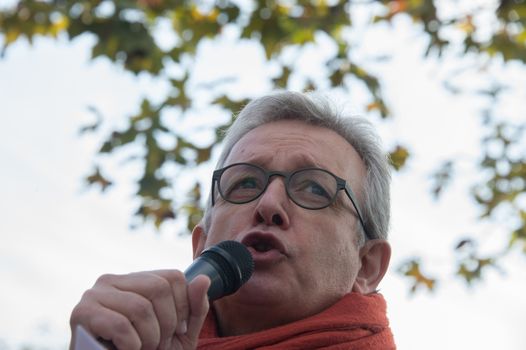 FRANCE, Paris : National head of Communist party Pierre Laurent makes a speech while protesters gather in Place de la R�publique in Paris on October 11, 2015, for the second time after the terror attack in Ankara, in tribute to the victims of the twin explosion in Turkish capital city. On October 11, 2015, at least 95 people died after a twin explosion in the center of the capital city in Turkey. The Turkish government declared three days of mourning and said that it won't delay legislative elections expected for November 1st, 2015. 