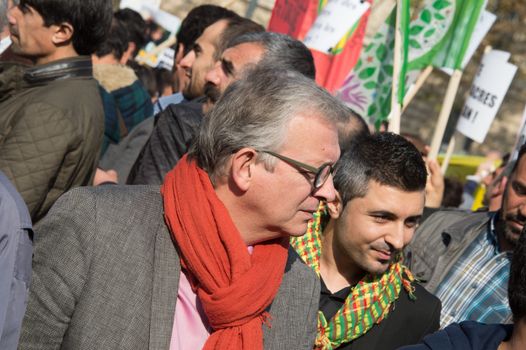 FRANCE, Paris : National head of Communist party Pierre Laurent stands while protesters gather in Place de la R�publique in Paris on October 11, 2015, for the second time after the terror attack in Ankara, in tribute to the victims of the twin explosion in Turkish capital city. On October 11, 2015, at least 95 people died after a twin explosion in the center of the capital city in Turkey. The Turkish government declared three days of mourning and said that it won't delay legislative elections expected for November 1st, 2015. 