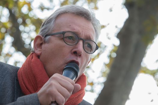 FRANCE, Paris : National head of Communist party Pierre Laurent makes a speech while protesters gather in Place de la R�publique in Paris on October 11, 2015, for the second time after the terror attack in Ankara, in tribute to the victims of the twin explosion in Turkish capital city. On October 11, 2015, at least 95 people died after a twin explosion in the center of the capital city in Turkey. The Turkish government declared three days of mourning and said that it won't delay legislative elections expected for November 1st, 2015. 