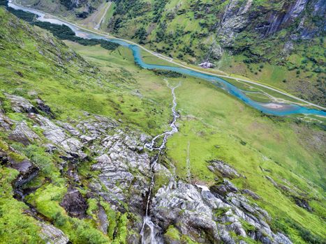 Aerial view of picturesque green valley with water streams, Norway