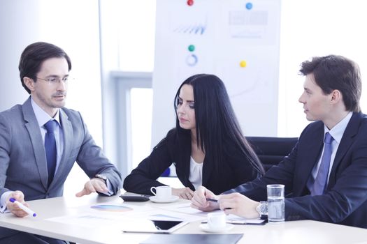 Business people discussing financial reports during a meeting