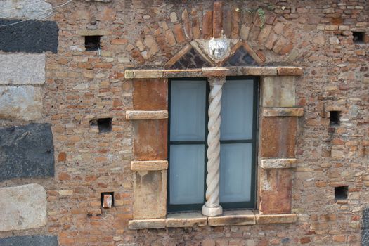 Italy: old window and rocky wall