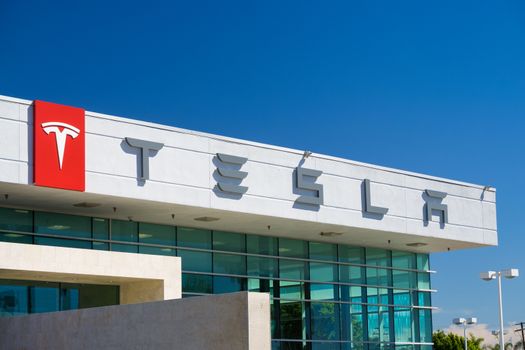 BUENA PARK, CA/USA - OCTOBER 10, 2015: Tesla Motors automobile dealership. Tesla Motors, Inc. is an American automotive and energy storage company.