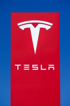 BUENA PARK, CA/USA - OCTOBER 10, 2015: Tesla Motors automobile sign. Tesla Motors, Inc. is an American automotive and energy storage company.