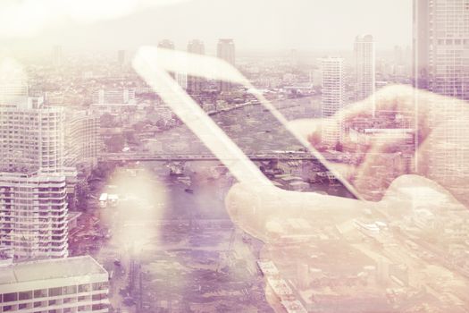 Double exposure image of people with smart phone and cityscape background,Business technology concept.