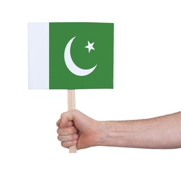 Hand holding small card, isolated on white - Flag of Pakistan