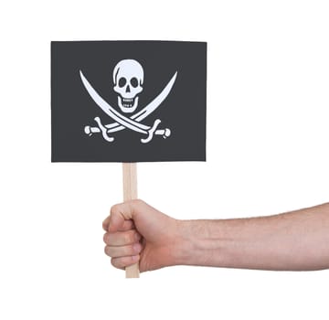 Hand holding small card, isolated on white - Flag of Pirate