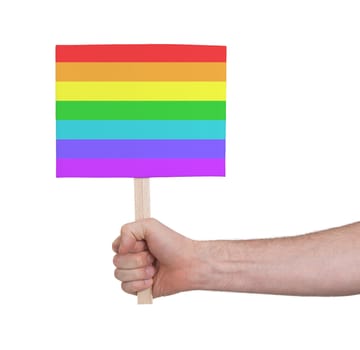 Hand holding small card, isolated on white - Flag of Rainbow flag
