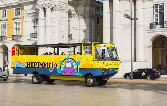 LISBON, PORTUGAL - SEPTEMBER 26, 2015: Sightseeing amphibian bus HIPPOtrip is crossing the streetsof Lissabon on n September 26, 2015. Lisbon is a capital and must famous city of Portugal