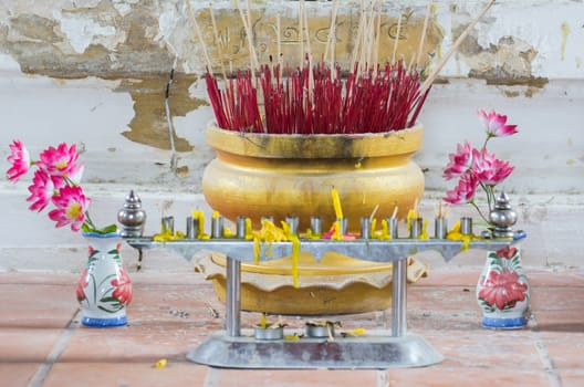 Joss sticks burn at a thailand temple