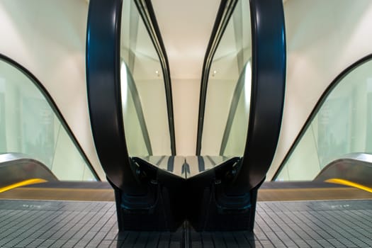 Escalators move indoor public building.