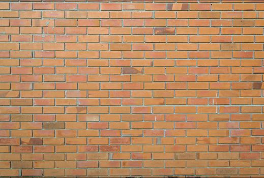 Old walls built with orange brick.